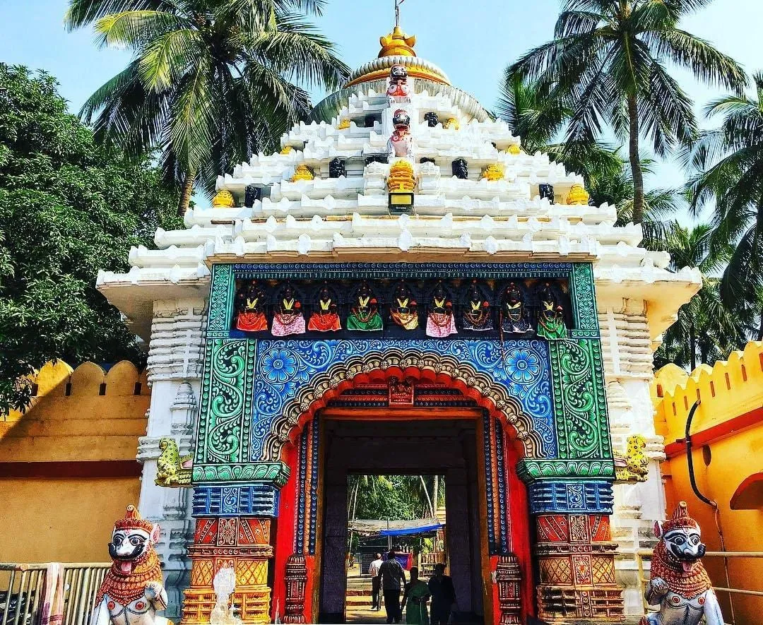 A closer view of the gate’s painted deity figures and tilework