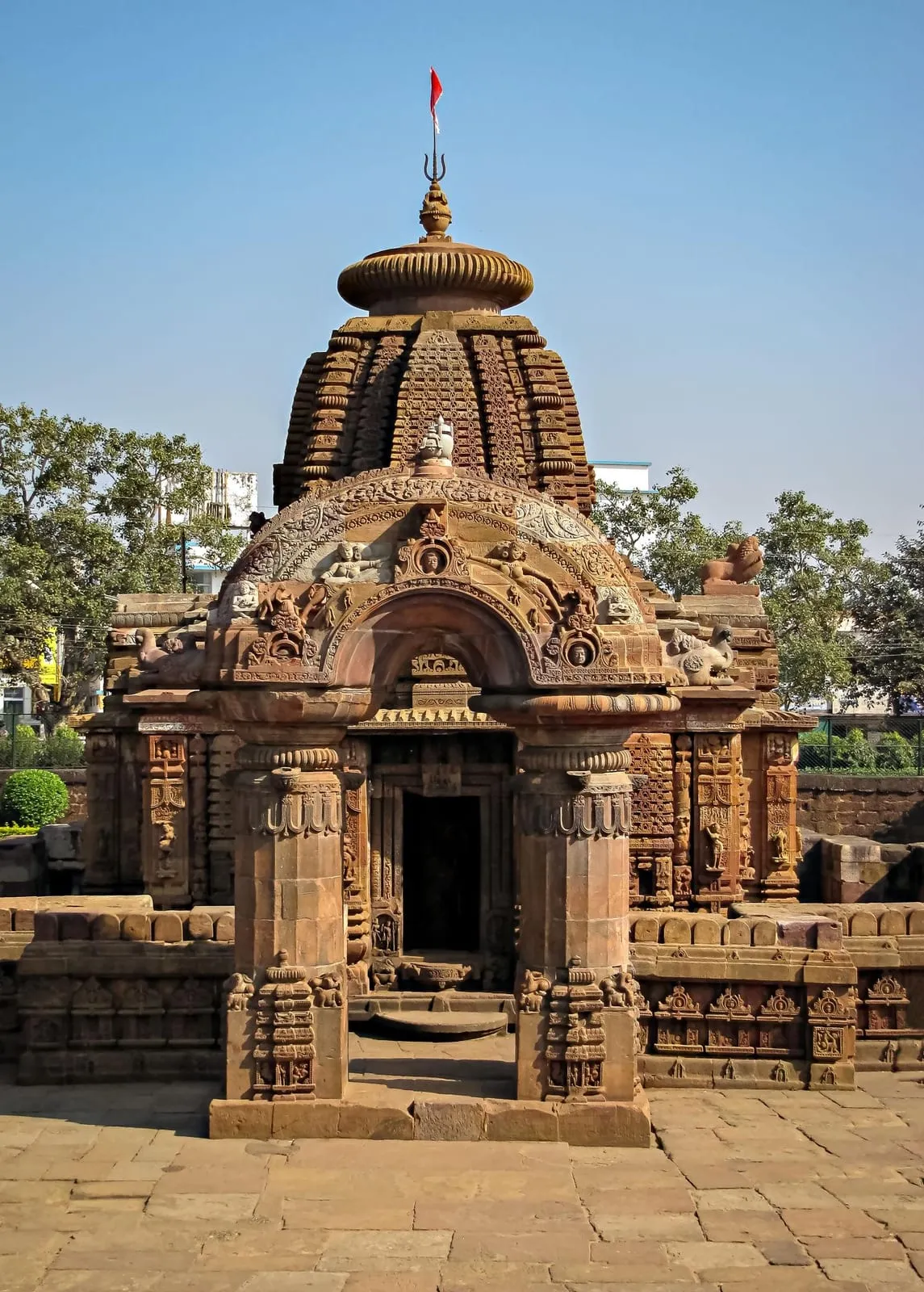 The temple’s shikhara and torana-framed entrance