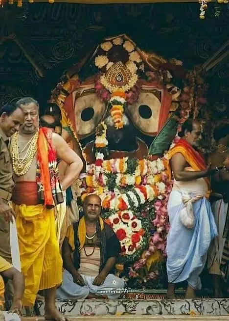 Lord Jagannath adorned with floral garlands during temple rituals