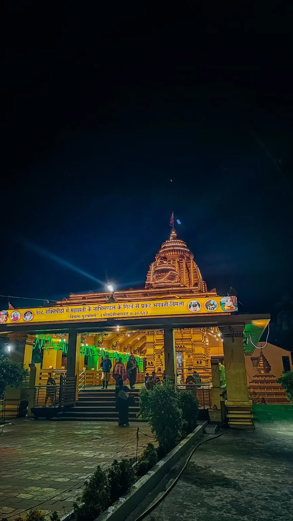 The Vimala shrine, lit for evening darshan, with the Shakti Peetha legend inscribed above the entrance